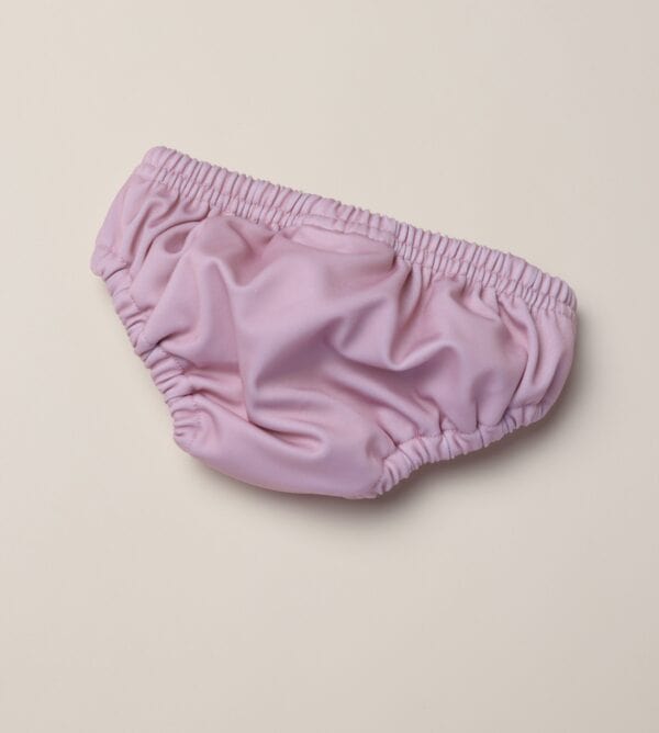 An image of a purple Lumi Brief Swim Nappy on a white background.