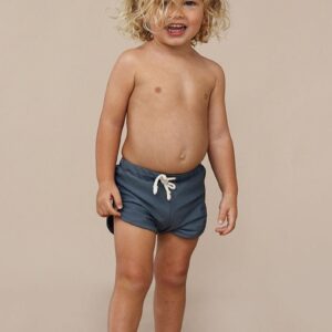 A young boy wearing Mesa Trunks.