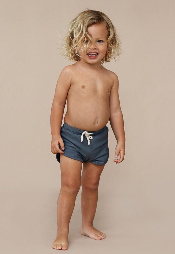A young boy wearing Mesa Trunks.