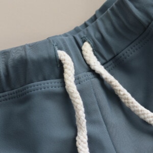 A close up of a pair of Mesa Trunks with a white drawstring.