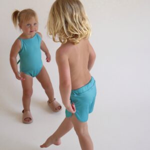 Two little girls in Sorbet Summer - Mesa Trunks standing next to each other.
