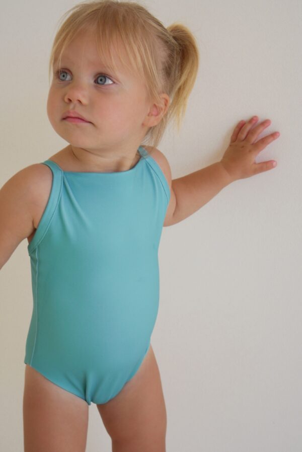 A little girl in a Sorbet Summer - Mara One-Piece swimsuit.